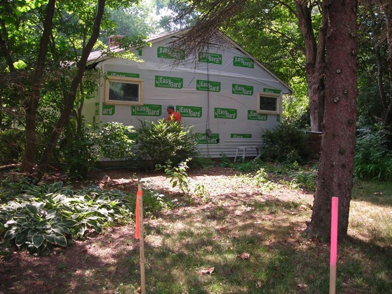 New light gray siding installation